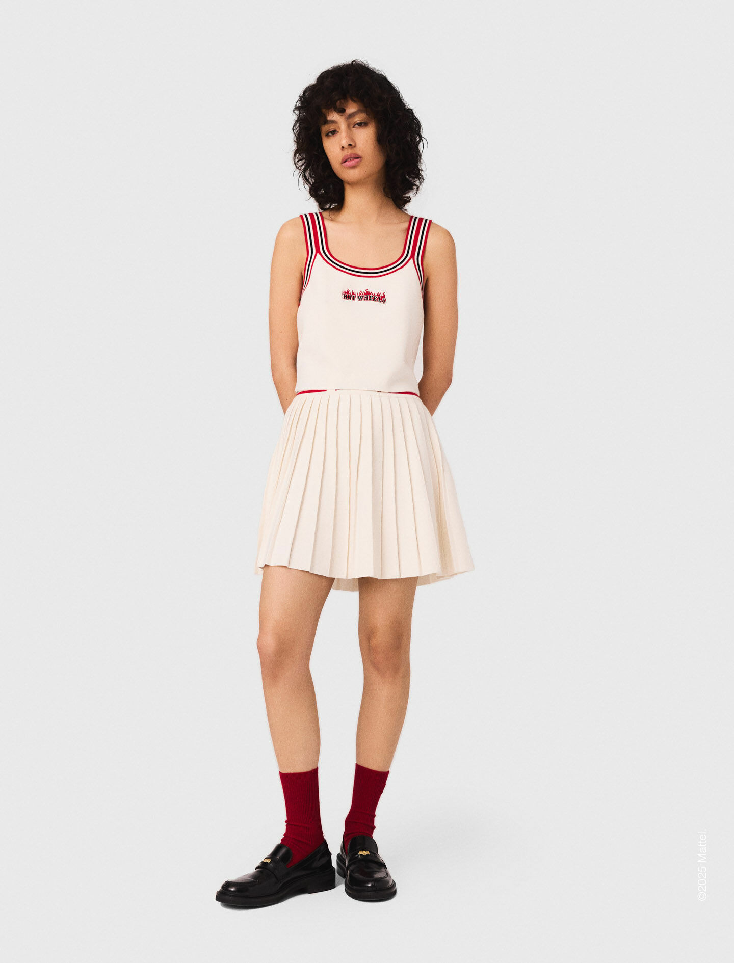 Jupe courte plissée en maille