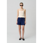 Top satiné à volants