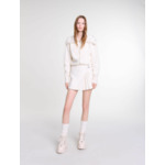 Jupe short plissée en tweed