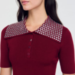 Pull à col orné de pastilles